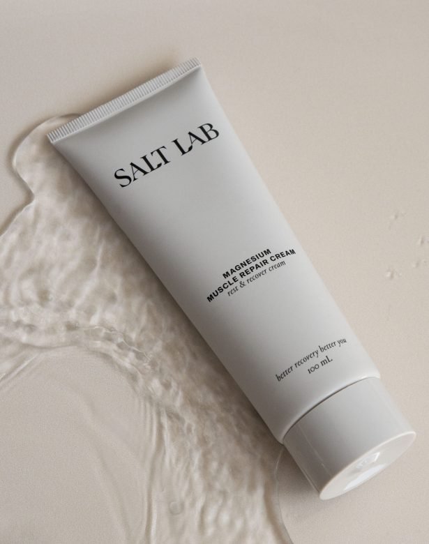 product photo of salt lab magnesium cream on beige background with water